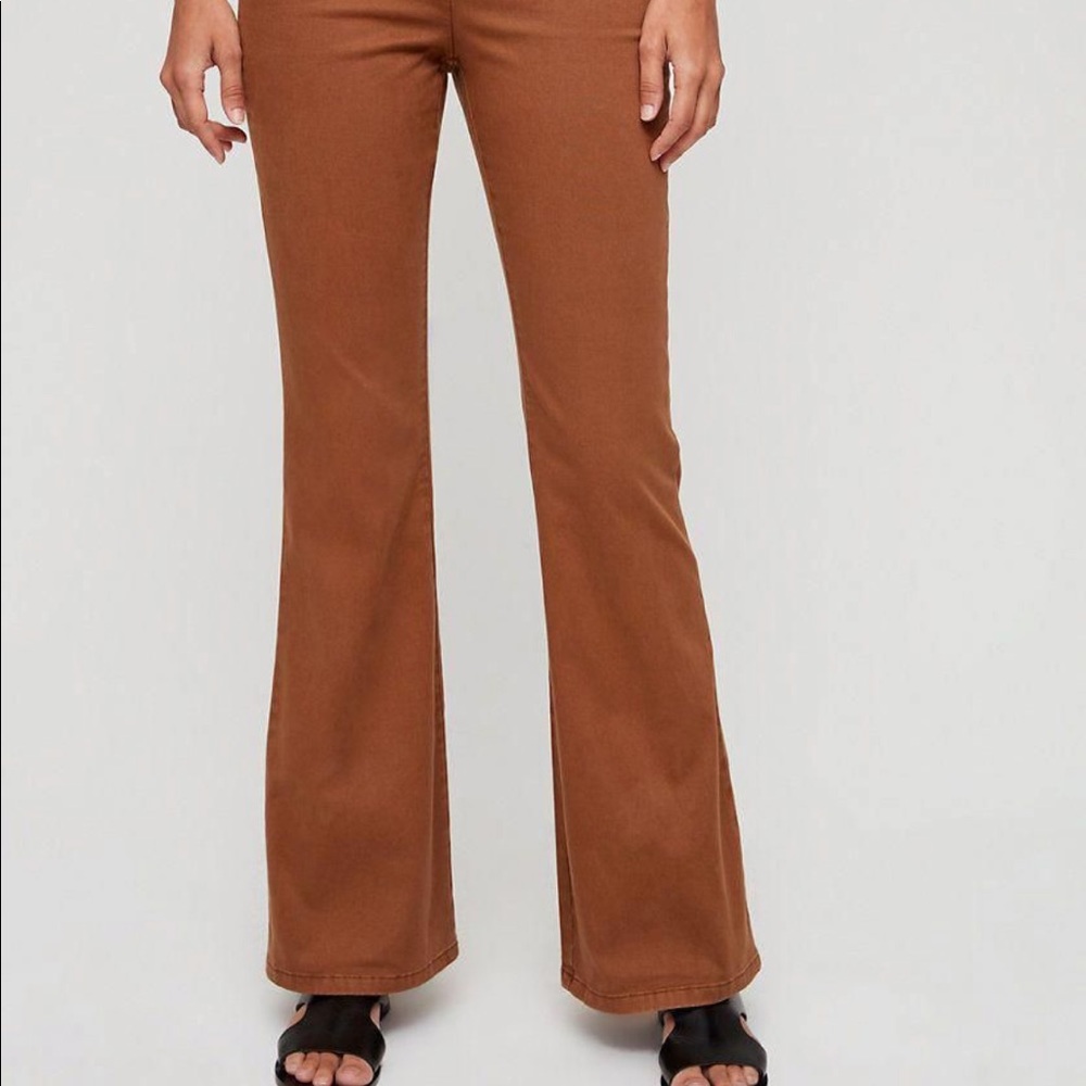 The Group Babaton (Aritzia) flared WHITE jeans.